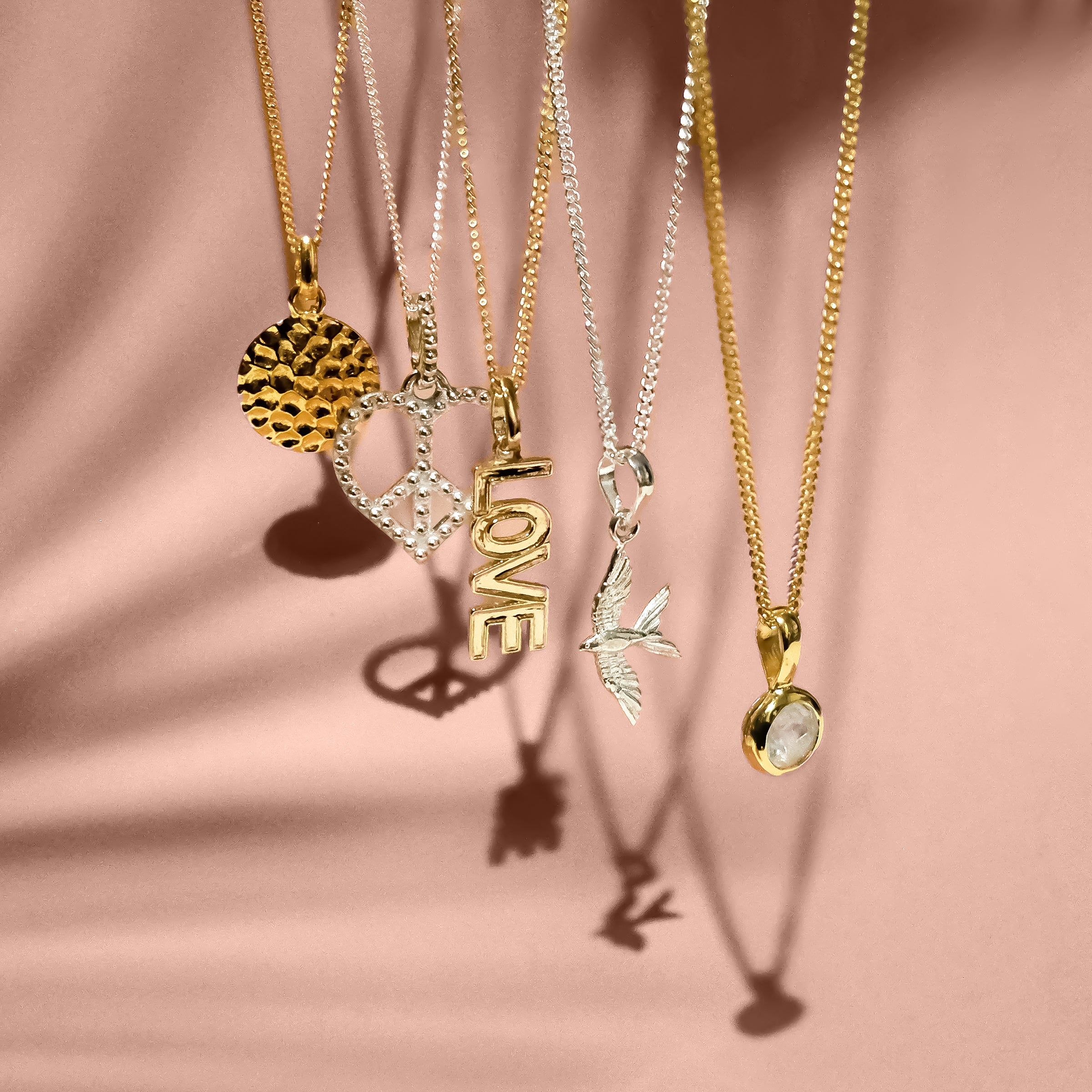 Silver and gold pendant necklaces