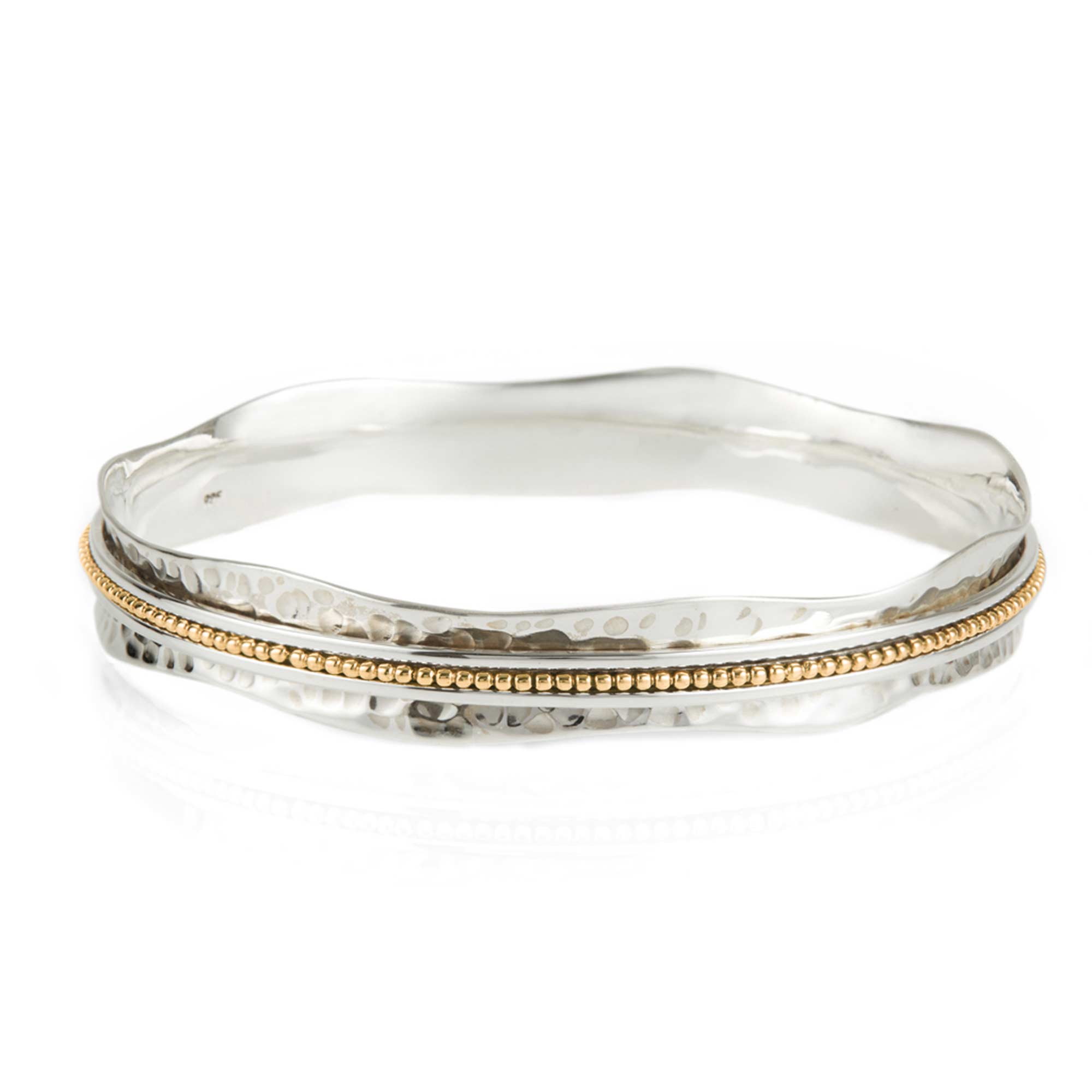 A two-tone (silver and gold) Aura Halo Spinning Bangle bracelet . Mixed Metal Spinning Bangle