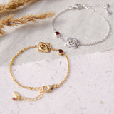 gold and Sterling silver root chakra bracelet with red garnet gemstone