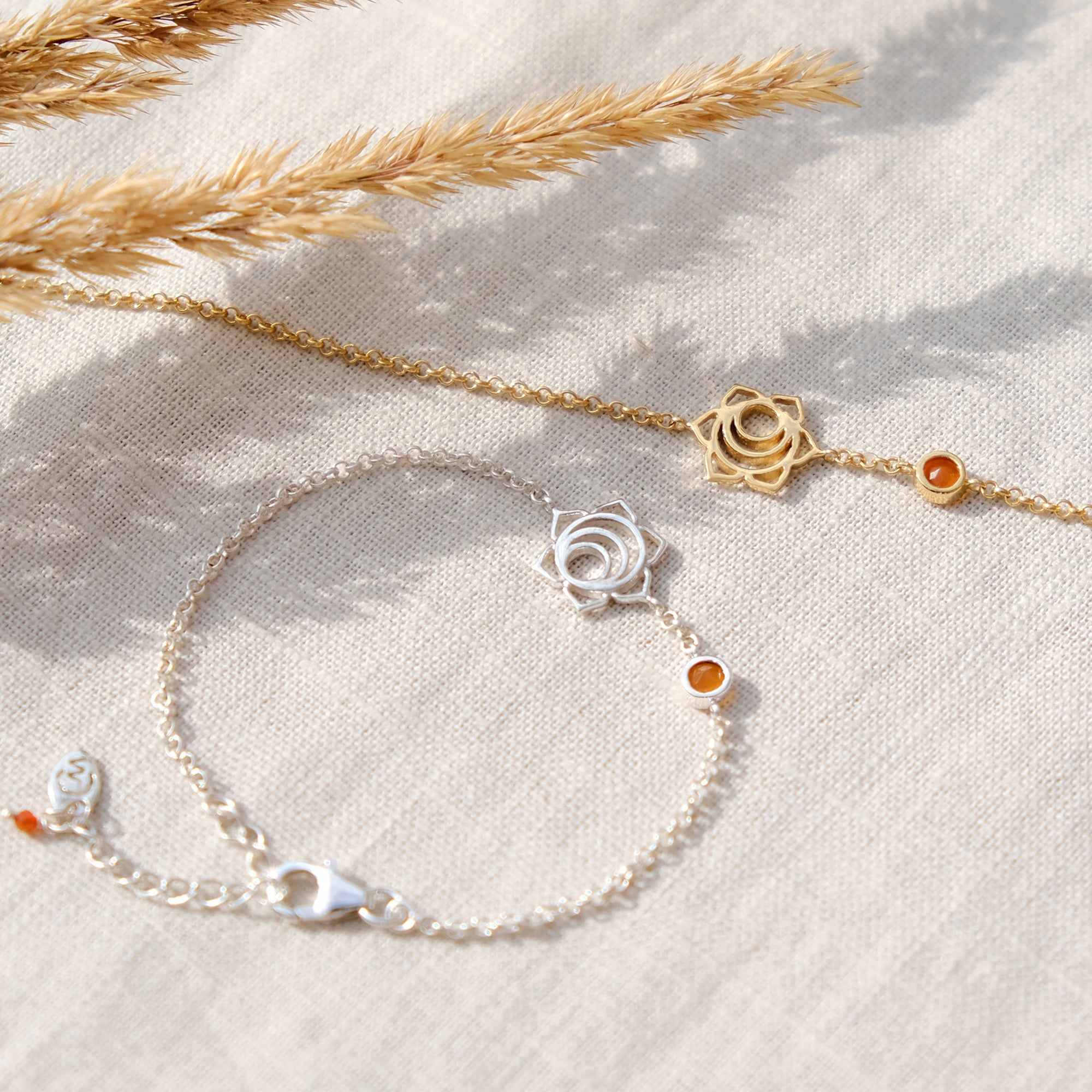 gold and sterling silver sacral chakra bracelet with carnelian gemstone