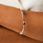 Sterling silver handmade bracelet with lolite gemstones in diamonds on a ladies wrist 