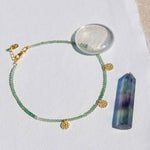 gold and green onyx beaded anklet flatlay 