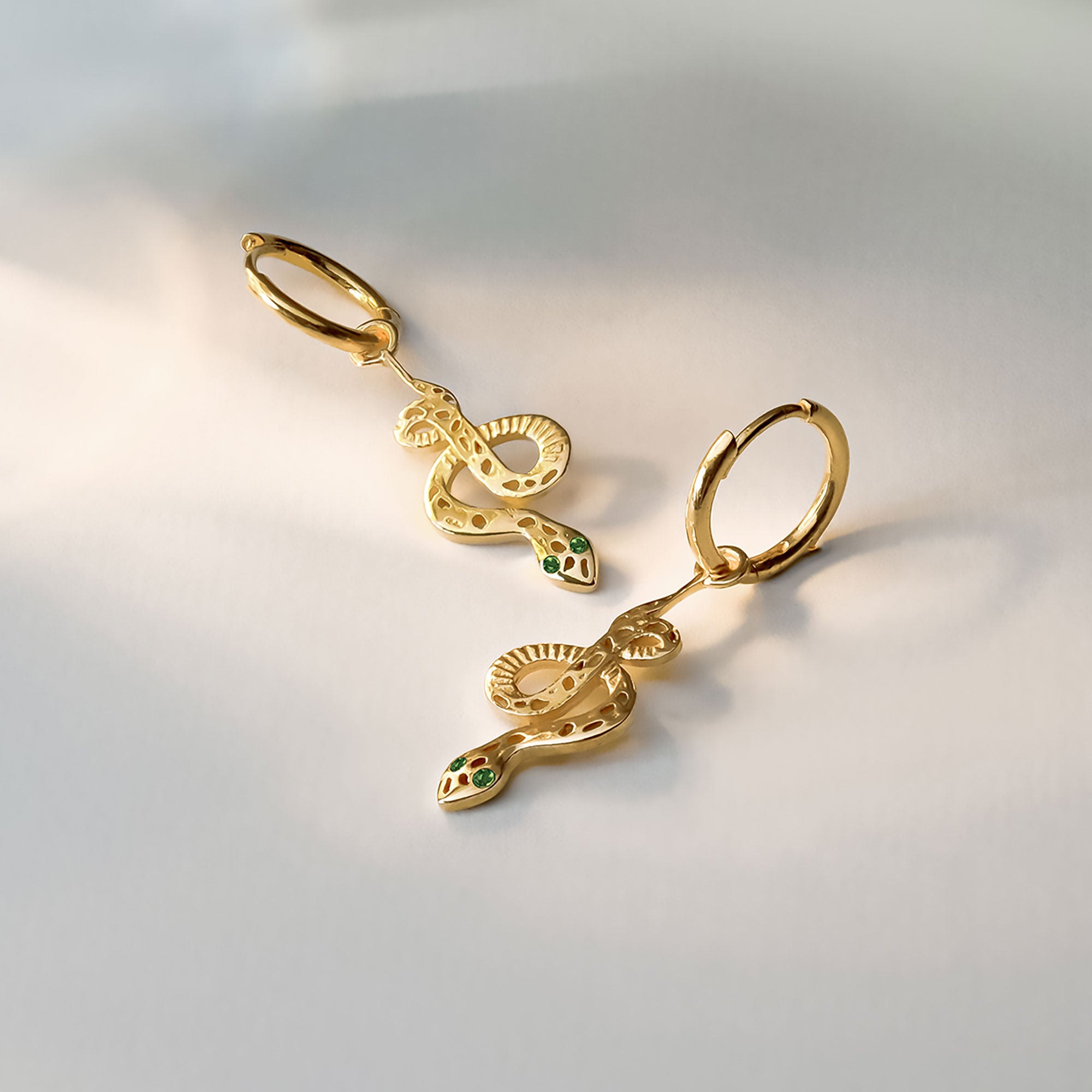 Gold snake earrings, Gold serpent earrings, Gold snake huggie hoops, Gold snake huggie hoop earrings, Snake earrings with emerald eyes, Emerald gemstone, May birthstone, Gold huggie hoops