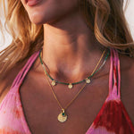 Beaded necklace made with green onyx with gold charms