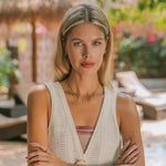 Gold charm necklace with blue topaz stones