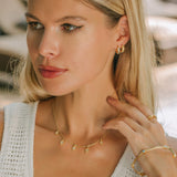 Blue topaz gemstones on gold necklace