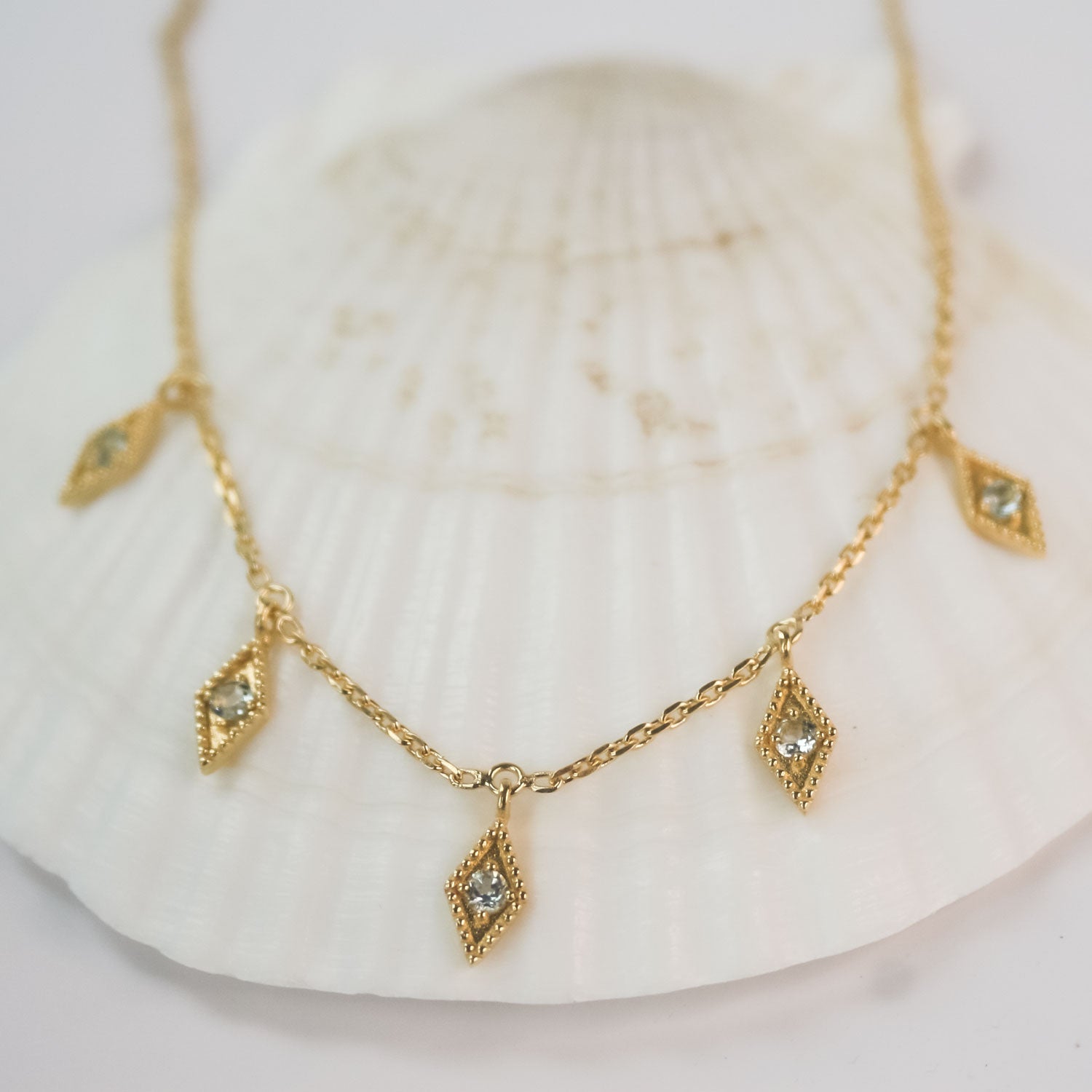 Delicate gold and blue topaz necklace