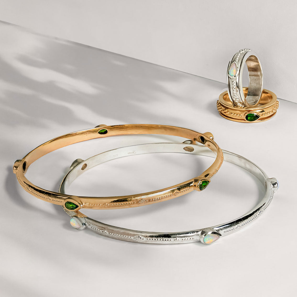 Sterling silver and gold plated gemstone spinning rings and stacking bangles, Silver and opal spinning ring, October birthstone spin ring, Gold and chrome diopside spinning ring, Silver and opal stacking bangle, Gold and green gemstone stacking bangle