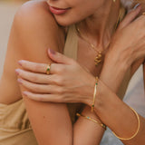 Yellow gold and chrome diopside spinning ring and stacking bange, Gold gemstone stacking bangles, Gold gemstone spinner ring