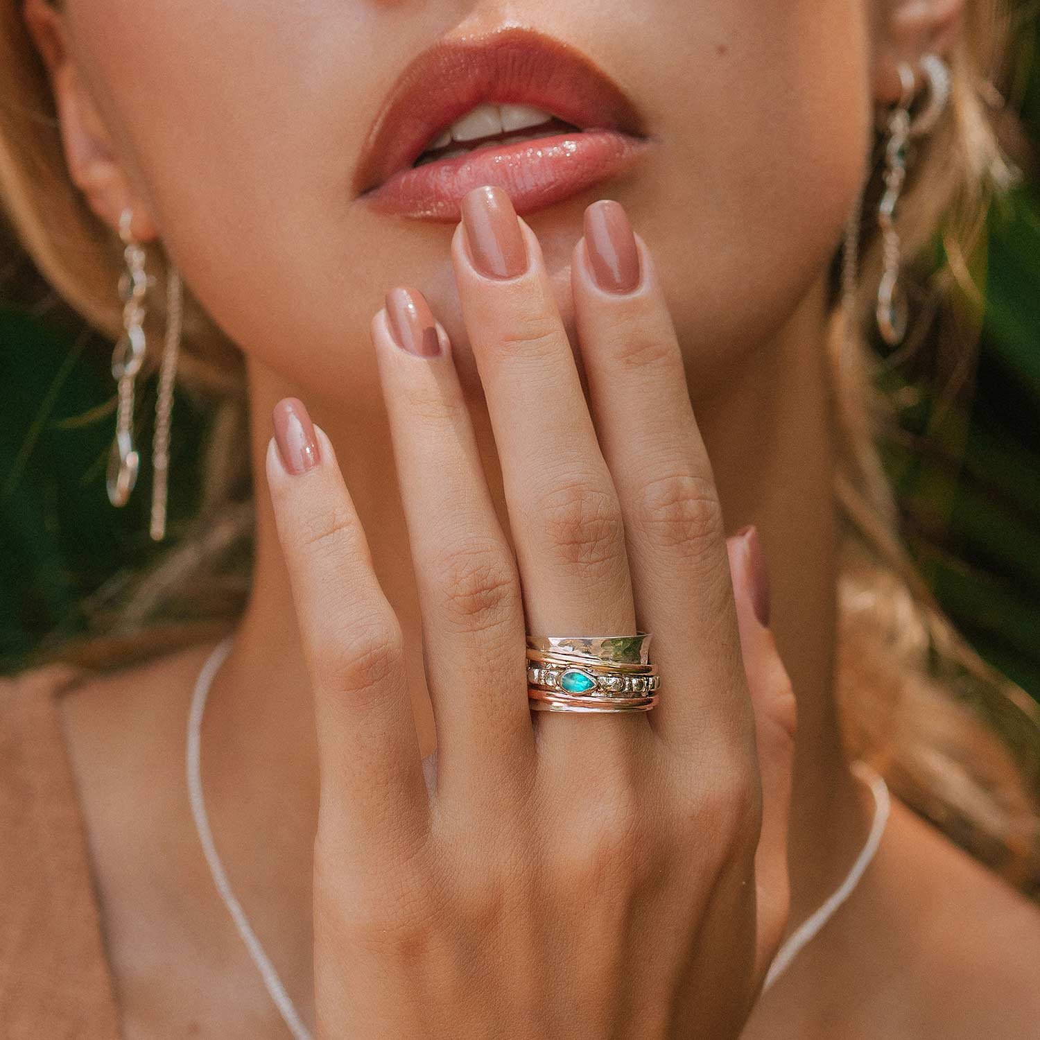 Three band silver spinning ring with pariaba topaz gemstone