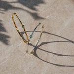 Emerald gold and silver bangles