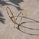 Emerald gold and silver bangles